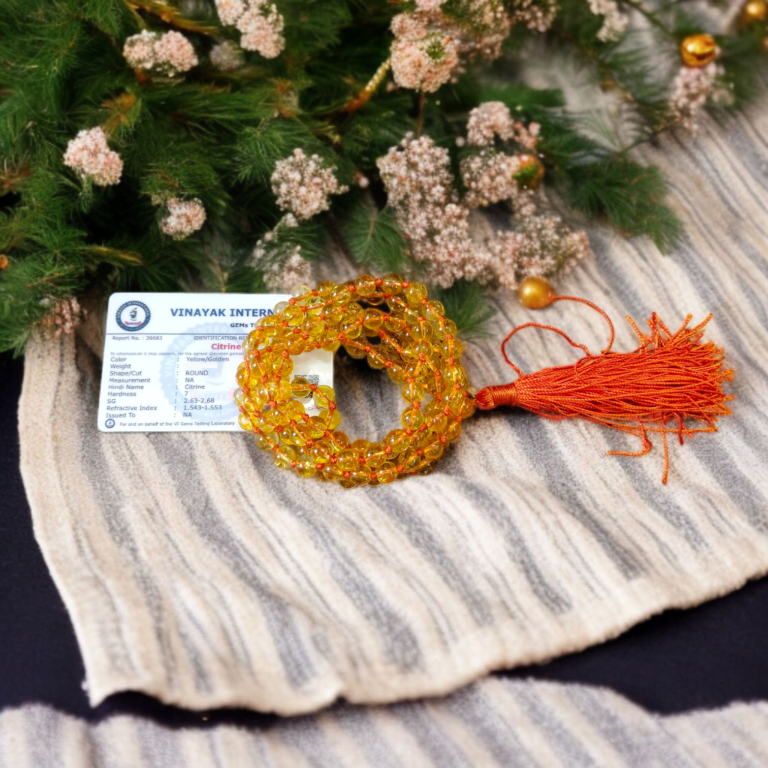 A 108+1 bead mala made from polished 8mm natural Citrine stones, ideal for spiritual meditation, Japa chanting, and chakra healing practices