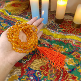 A 108+1 bead mala made from polished 8mm natural Citrine stones, ideal for spiritual meditation, Japa chanting, and chakra healing practices