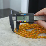 A 108+1 bead mala made from polished 8mm natural Citrine stones, ideal for spiritual meditation, Japa chanting, and chakra healing practices