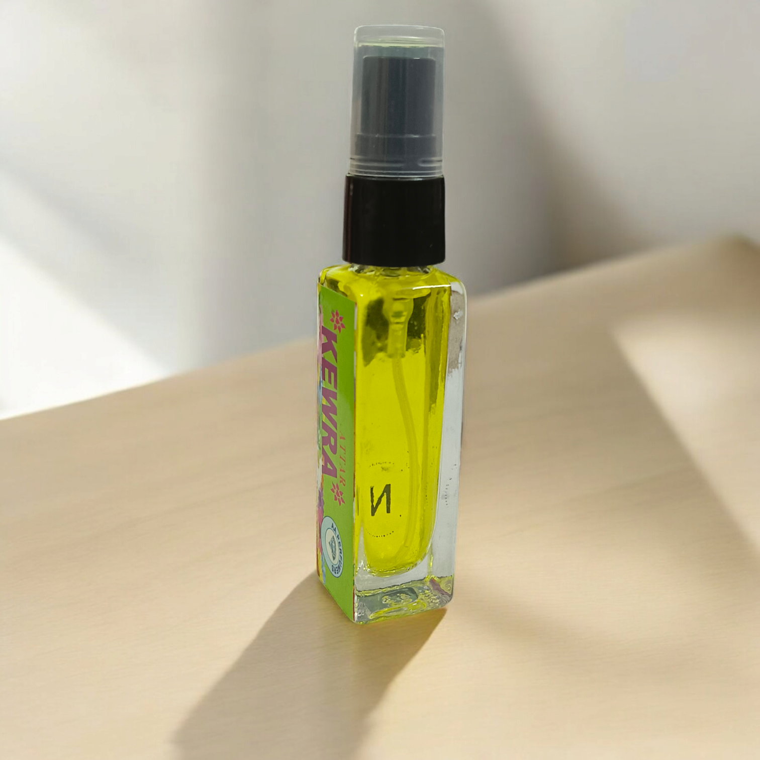 A 25ML bottle of Kewra Spray Attar, a premium, alcohol-free floral fragrance perfect for worship, meditation, and daily use, with divine qualities.