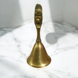 A 7cm Bajarng Balli Brass Hand Bell, crafted from pure brass, ideal for religious rituals, enhancing spiritual ambiance and inviting positive energy.