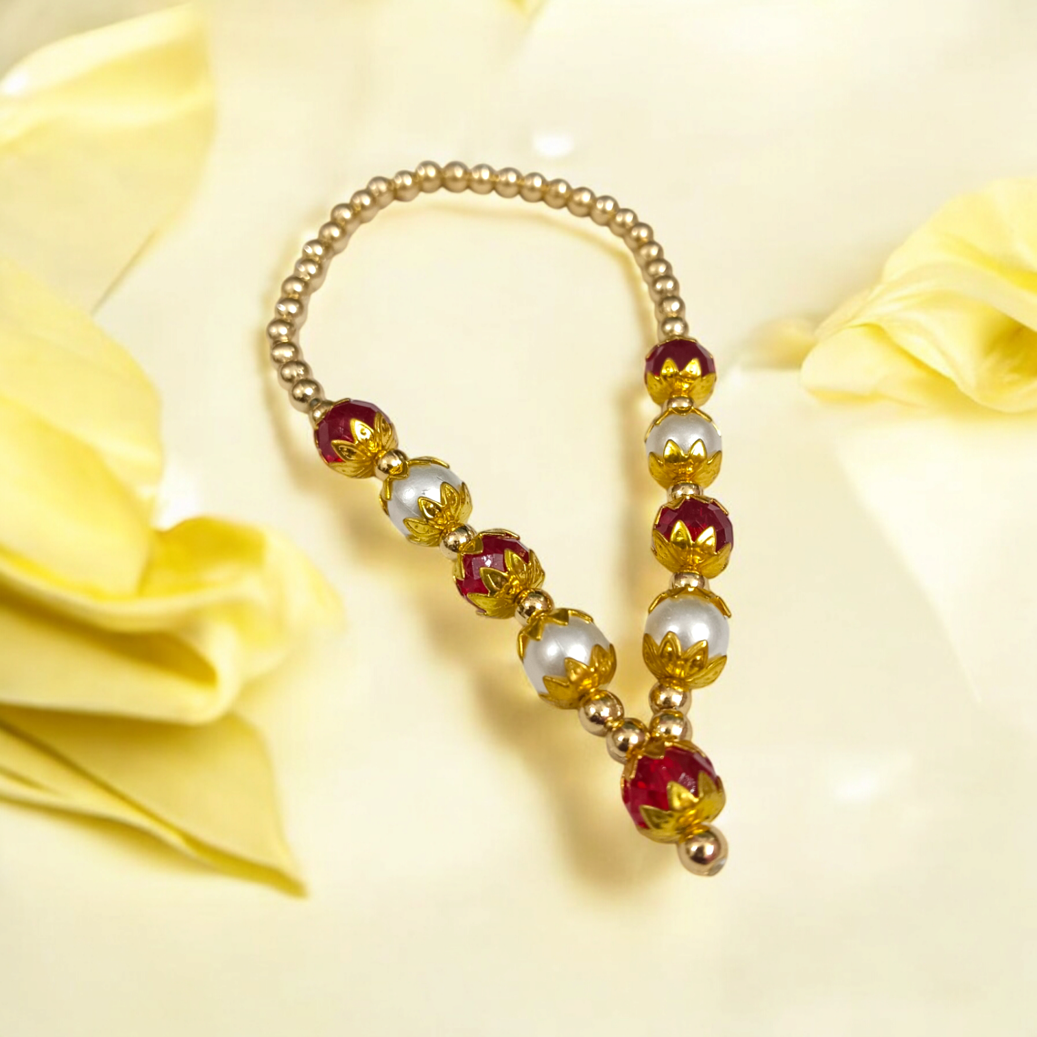 A Laddu Gopal Mala made with pearls and zircon stones, designed for adorning small Krishna idols. The elegant garland adds beauty and divine charm to the idol.