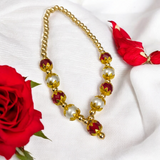 A Laddu Gopal Mala made with pearls and zircon stones, designed for adorning small Krishna idols. The elegant garland adds beauty and divine charm to the idol.
