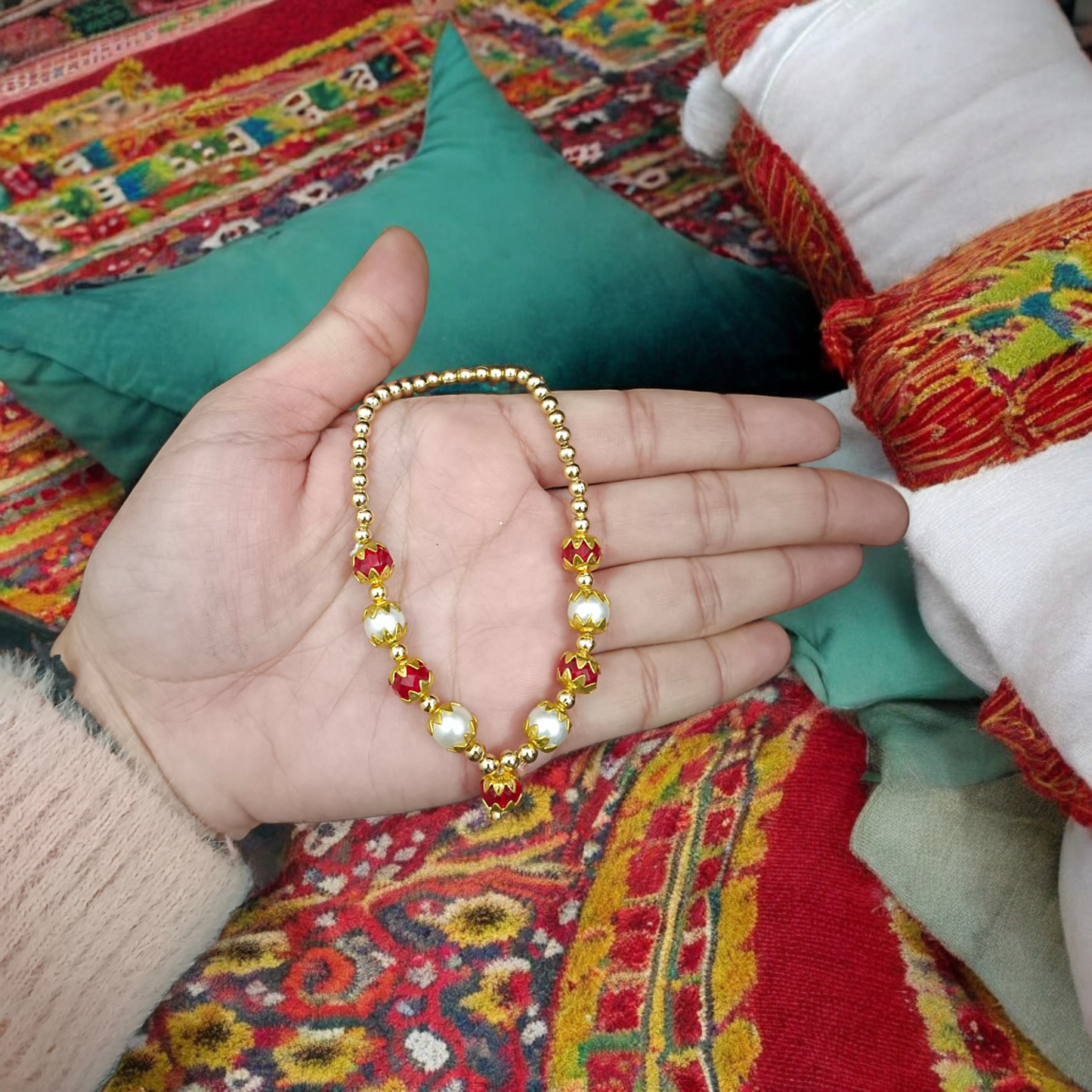A Laddu Gopal Mala made with pearls and zircon stones, designed for adorning small Krishna idols. The elegant garland adds beauty and divine charm to the idol.