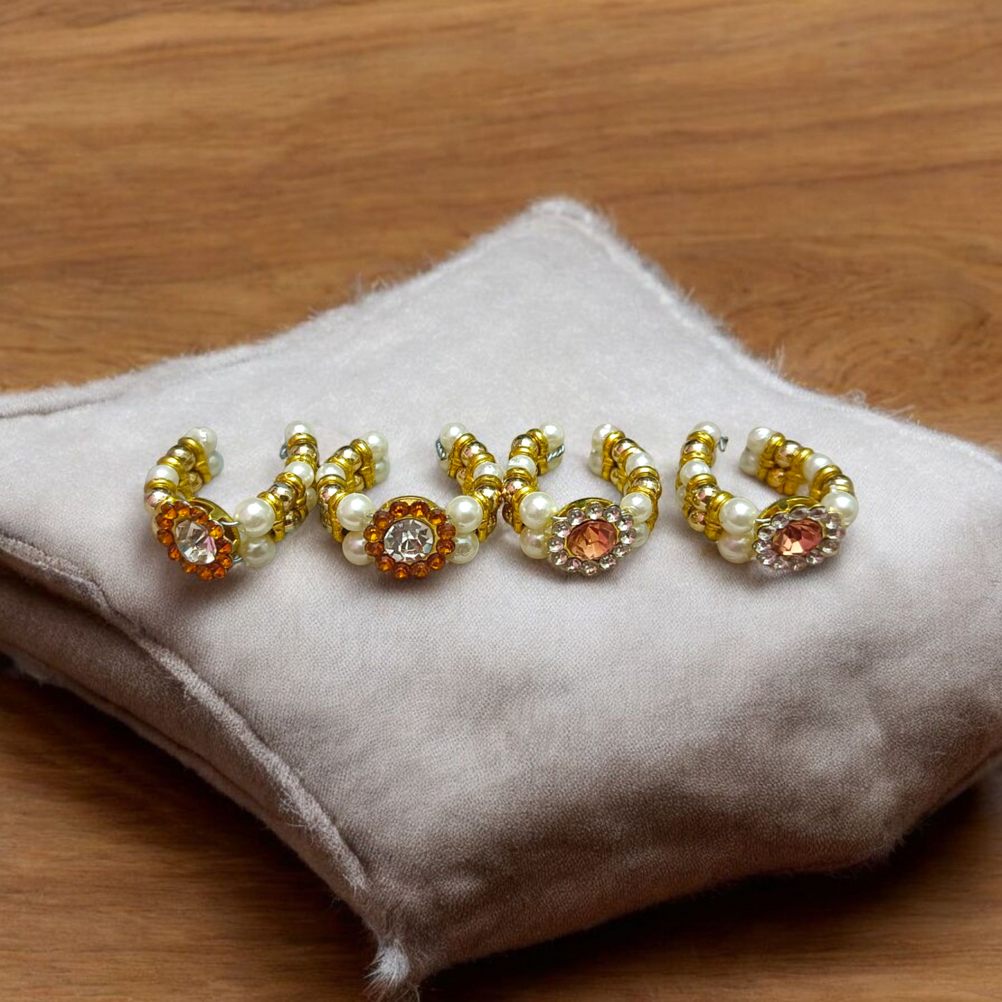 A Laddu Gopal Moti Kada Set, consisting of delicate pearl bracelets designed to adorn Krishna idols, adding divine beauty and elegance during worship and festivals.
