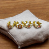 A Laddu Gopal Moti Kada Set, consisting of delicate pearl bracelets designed to adorn Krishna idols, adding divine beauty and elegance during worship and festivals.