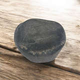 A Laxmi Narayan Shaligram stone featuring Lord Vishnu and Goddess Lakshmi's divine symbols, lab certified for purity and authenticity, perfect for worship and prosperity.