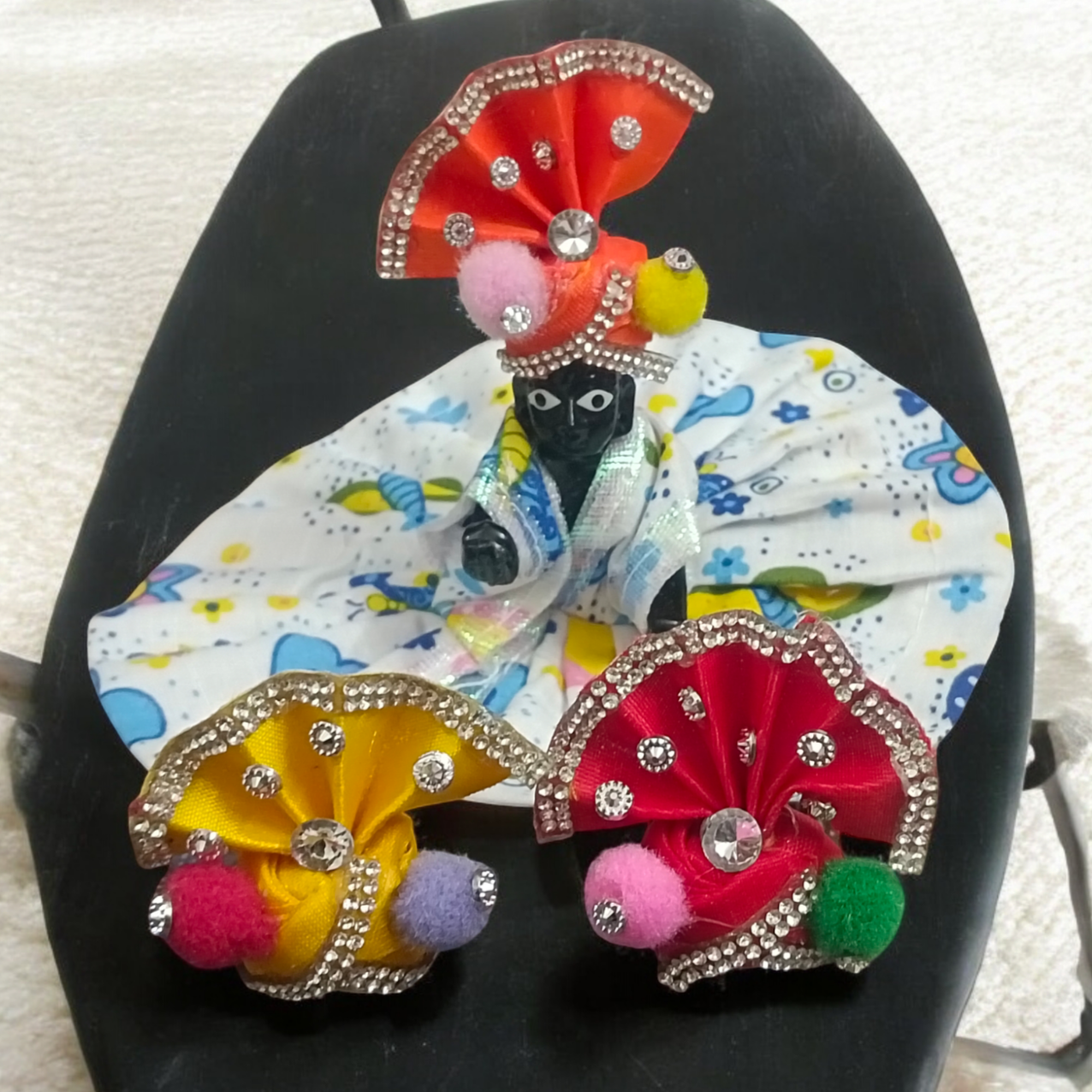 A Set of 3 Laddu Gopal Pagdis (crowns) for size 1 No. Krishna idols, designed to enhance the divine appearance of your Bal Gopal idol during worship and festivals.