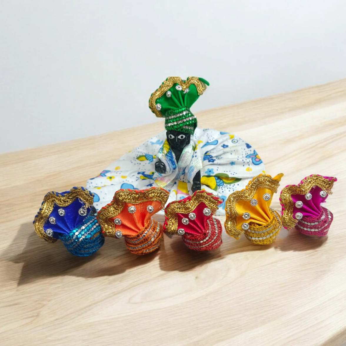 A Set of 6 Laddu Gopal Pagdis (crowns) designed for size 2 No. Krishna idols, perfect for adorning your Bal Gopal idol during daily worship, prayers, and festive occasions.