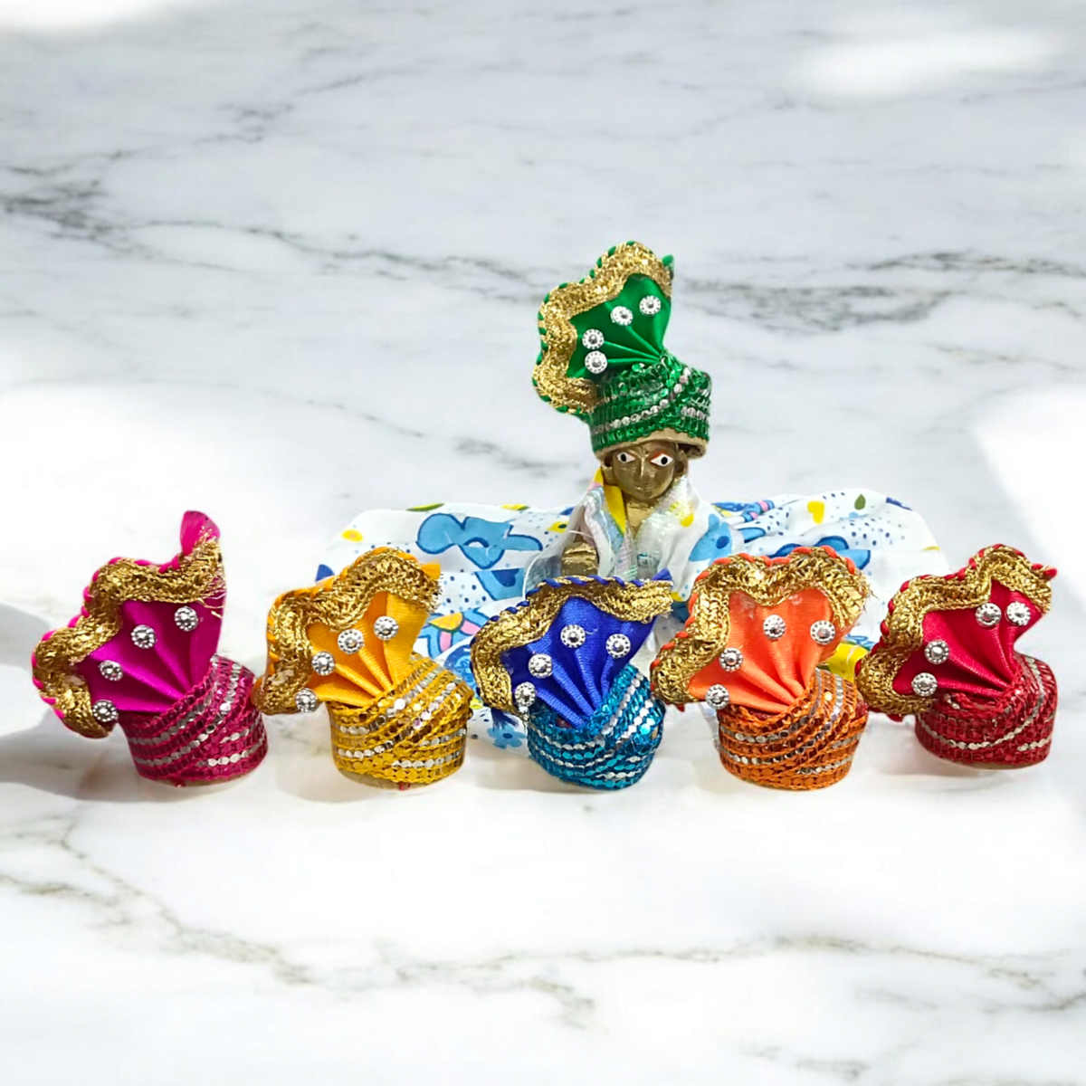 A Set of 6 Laddu Gopal Pagdis (crowns) designed for size 3 No. Krishna idols, perfect for adorning your Bal Gopal idol during daily worship, prayers, and festive occasions.