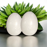 A White Marble Shivling Stone, symbolizing Lord Shiva, perfect for Tulsi leaves offerings, Puja rituals, and bringing spiritual growth, peace, and prosperity