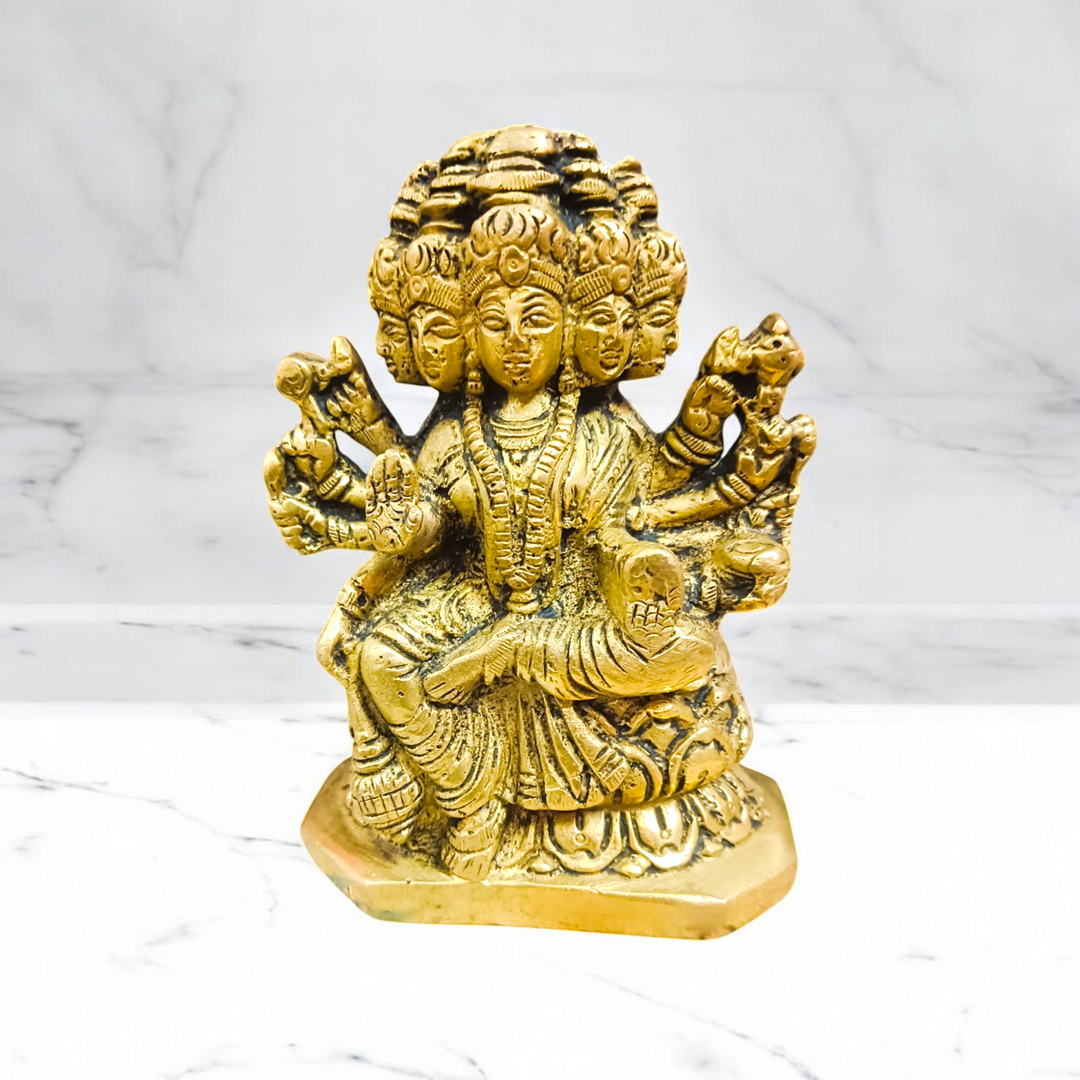 A beautiful 4-inch Gayatri Mata brass murti, gold-plated, with intricate craftsmanship, representing wisdom, knowledge, and spiritual enlightenment.