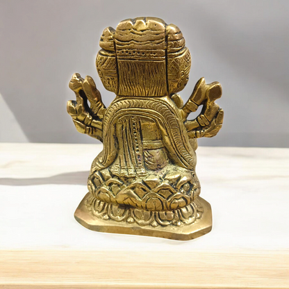 A beautiful 4-inch Gayatri Mata brass murti, gold-plated, with intricate craftsmanship, representing wisdom, knowledge, and spiritual enlightenment.