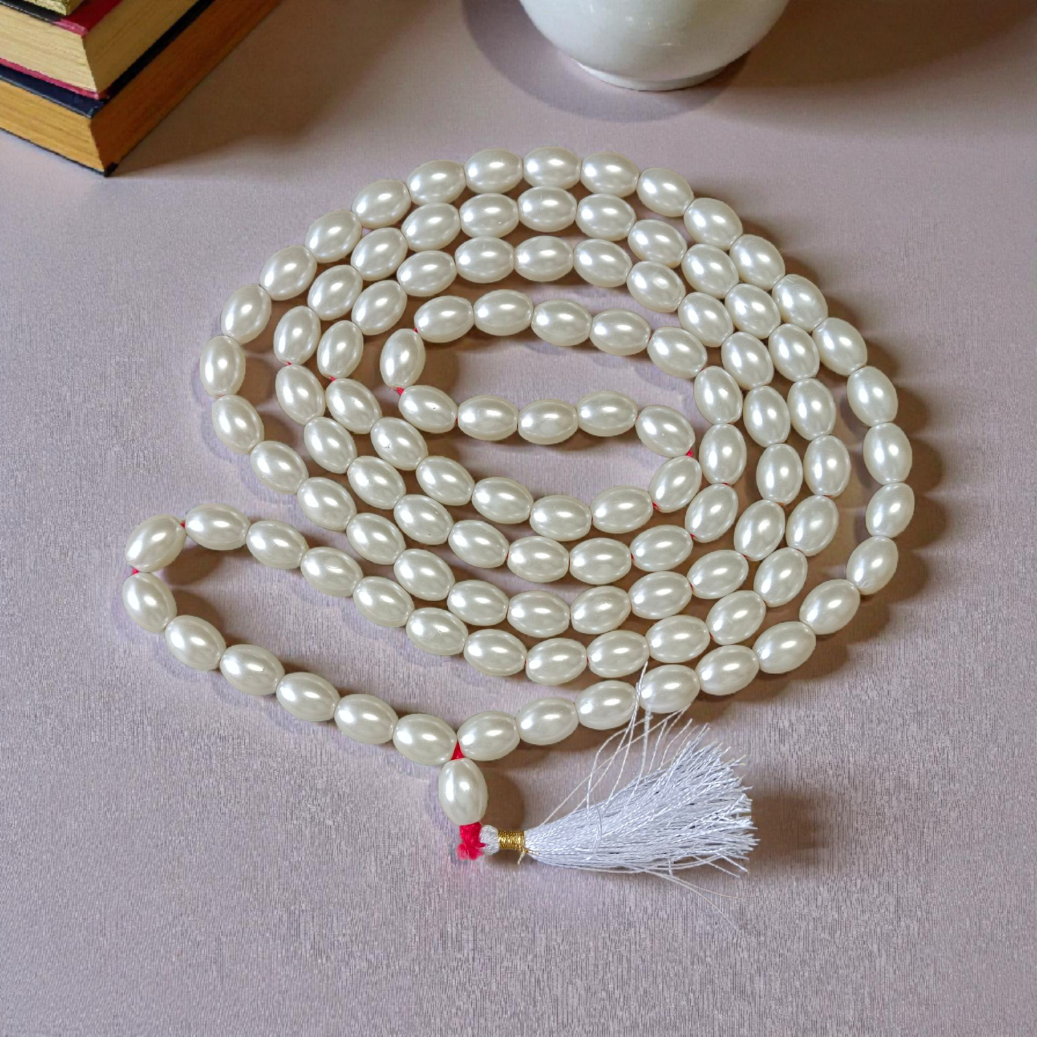 A beautiful lab-certified Natural Pearl Mala with 108+1 pure white Moti beads (10–11mm) designed for meditation, healing, and spiritual use