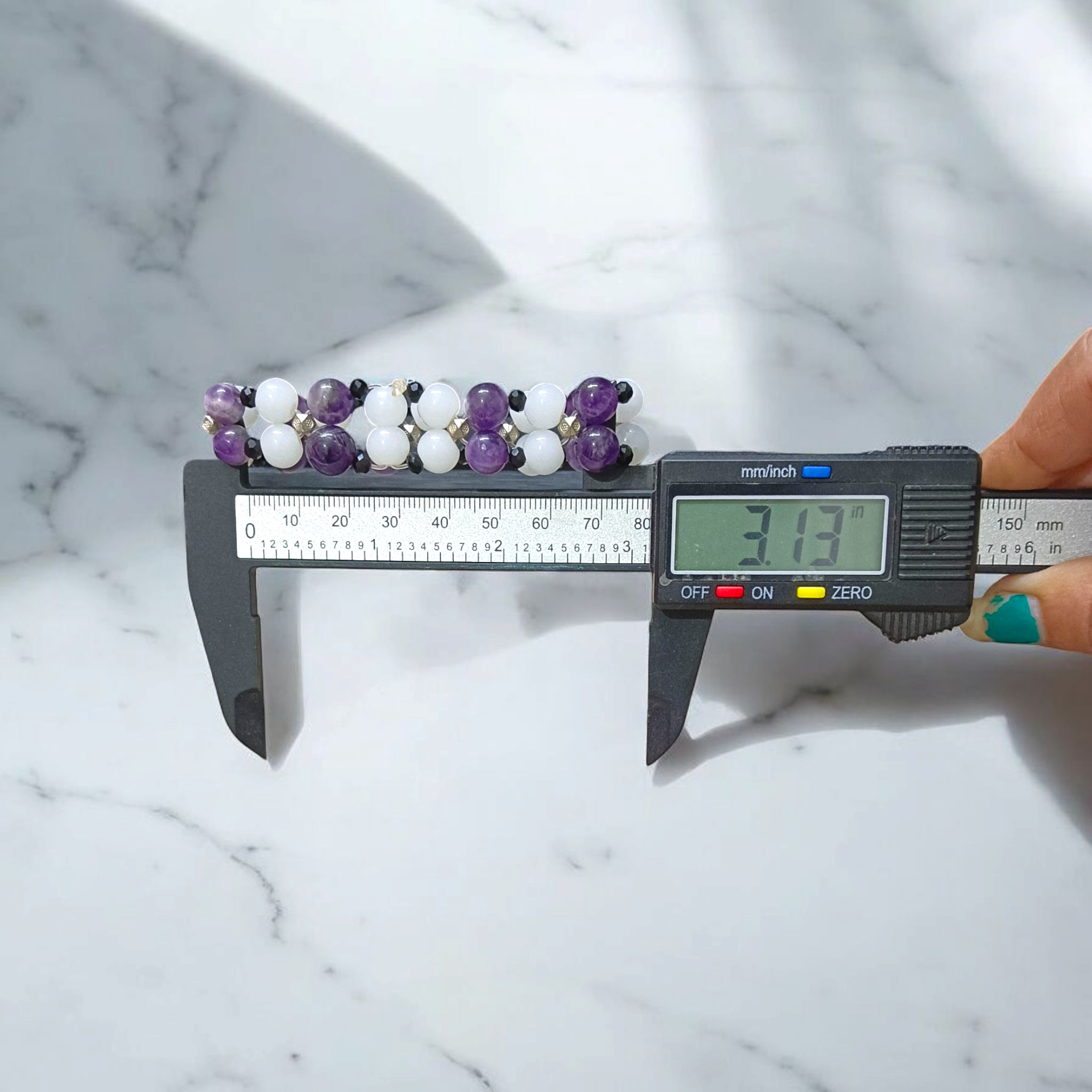 A beautiful stretchable bracelet made with 8mm Amethyst and White Agate beads, perfect for healing, emotional balance, and inner peace