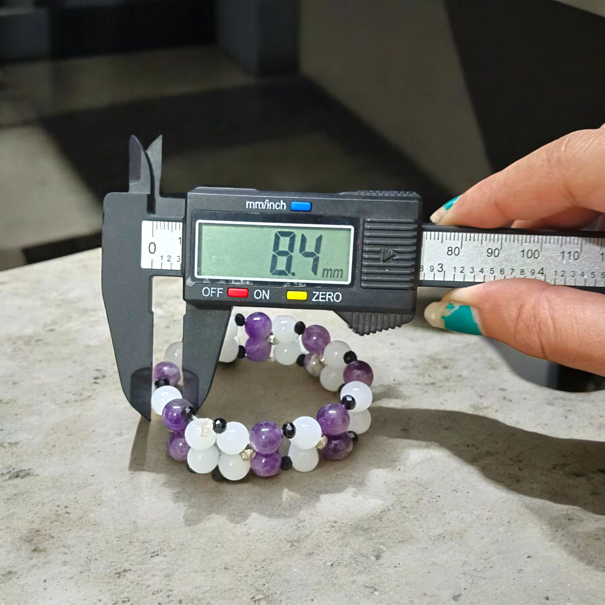 A beautiful stretchable bracelet made with 8mm Amethyst and White Agate beads, perfect for healing, emotional balance, and inner peace