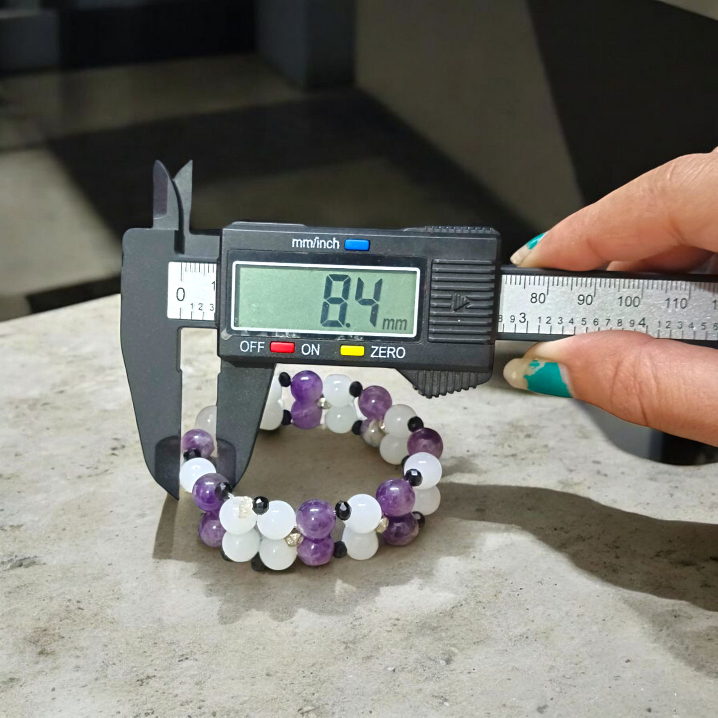 A beautiful stretchable bracelet made with 8mm Amethyst and White Agate beads, perfect for healing, emotional balance, and inner peace