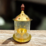 A beautifully crafted Brass Akhand Jyot with Borosilicate Glass, designed to burn desi ghee smoothly and safely, symbolizing spirituality and purity.