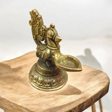 A beautifully crafted Peacock Brass Jyot with Nakshi peacock design, ideal for use in pooja rooms and spiritual spaces.