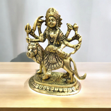 A beautifully crafted brass idol of Maa Durga, also known as Maa Sherawali, symbolizing strength, protection, and divine energy.