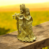 A beautifully crafted brass idol of Radha and Krishna, symbolizing divine love, perfect for worship and home decor.