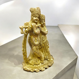 A beautifully crafted brass idol of Radha and Krishna, symbolizing divine love, perfect for worship and home decor.