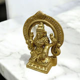 A beautifully crafted brass murti of Goddess Lakshmi, featuring intricate details and a golden finish, symbolizing wealth and prosperity.