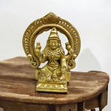 A beautifully crafted brass murti of Goddess Lakshmi, featuring intricate details and a golden finish, symbolizing wealth and prosperity.