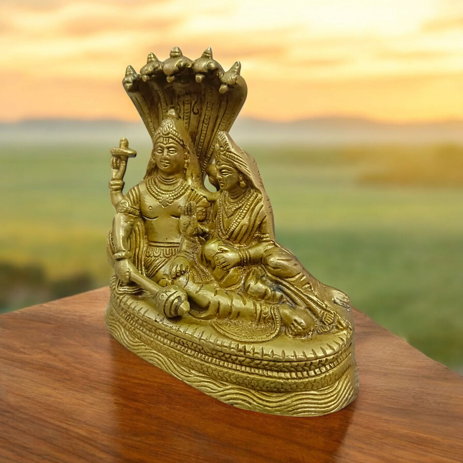 A beautifully crafted brass statue of Lord Lakshmi Narayan resting upon the Shesha Naag, symbolizing wealth, protection, and divine blessings.