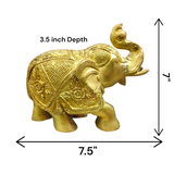 A beautifully crafted large brass elephant statue with an intricate design, symbolizing strength, prosperity, and good fortune, placed on an office table.

