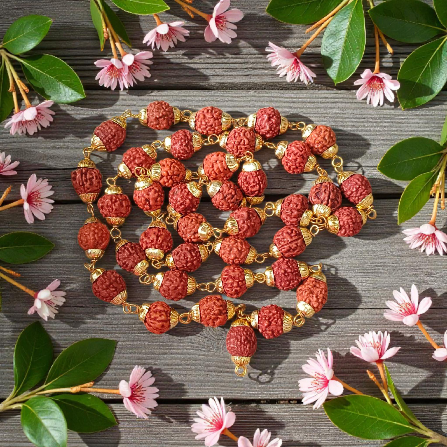 A beautifully handcrafted 5 Face Rudraksha Mala with 37+1 natural Rudraksha beads, golden caps, and lab certification, symbolizing peace and spirituality