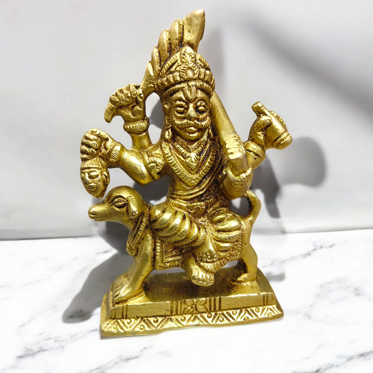 A beautifully handcrafted brass Kal Bhairav idol, 4 inches in size, with intricate detailing and a gold-plated finish, symbolizing protection and strength.

