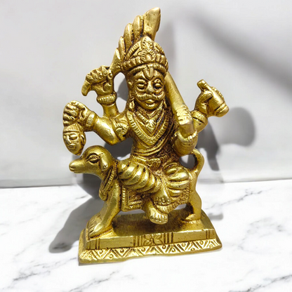 A beautifully handcrafted brass Kal Bhairav idol, 4 inches in size, with intricate detailing and a gold-plated finish, symbolizing protection and strength.

