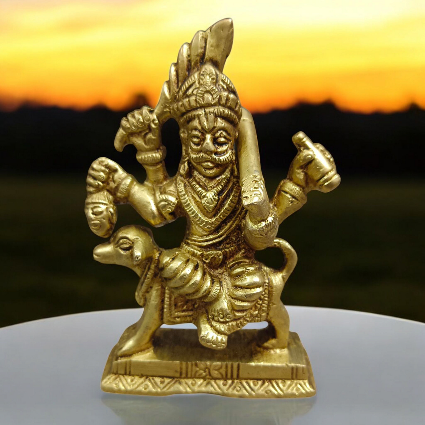 A beautifully handcrafted brass Kal Bhairav idol, 4 inches in size, with intricate detailing and a gold-plated finish, symbolizing protection and strength.

