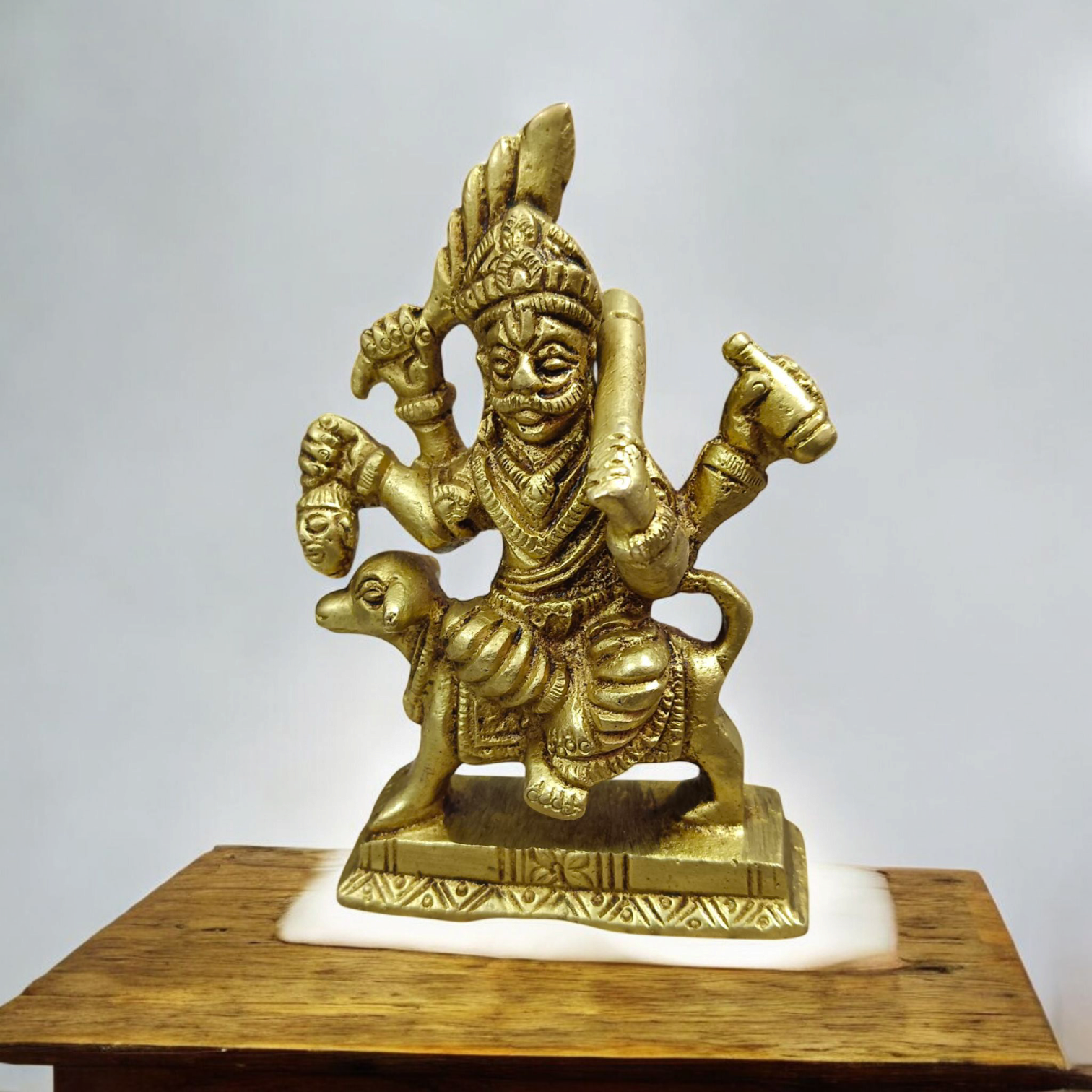 A beautifully handcrafted brass Kal Bhairav idol, 4 inches in size, with intricate detailing and a gold-plated finish, symbolizing protection and strength.

