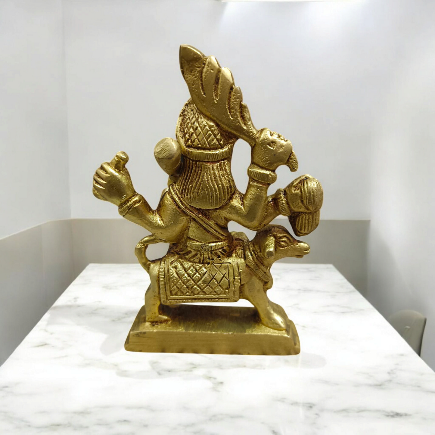 A beautifully handcrafted brass Kal Bhairav idol, 4 inches in size, with intricate detailing and a gold-plated finish, symbolizing protection and strength.

