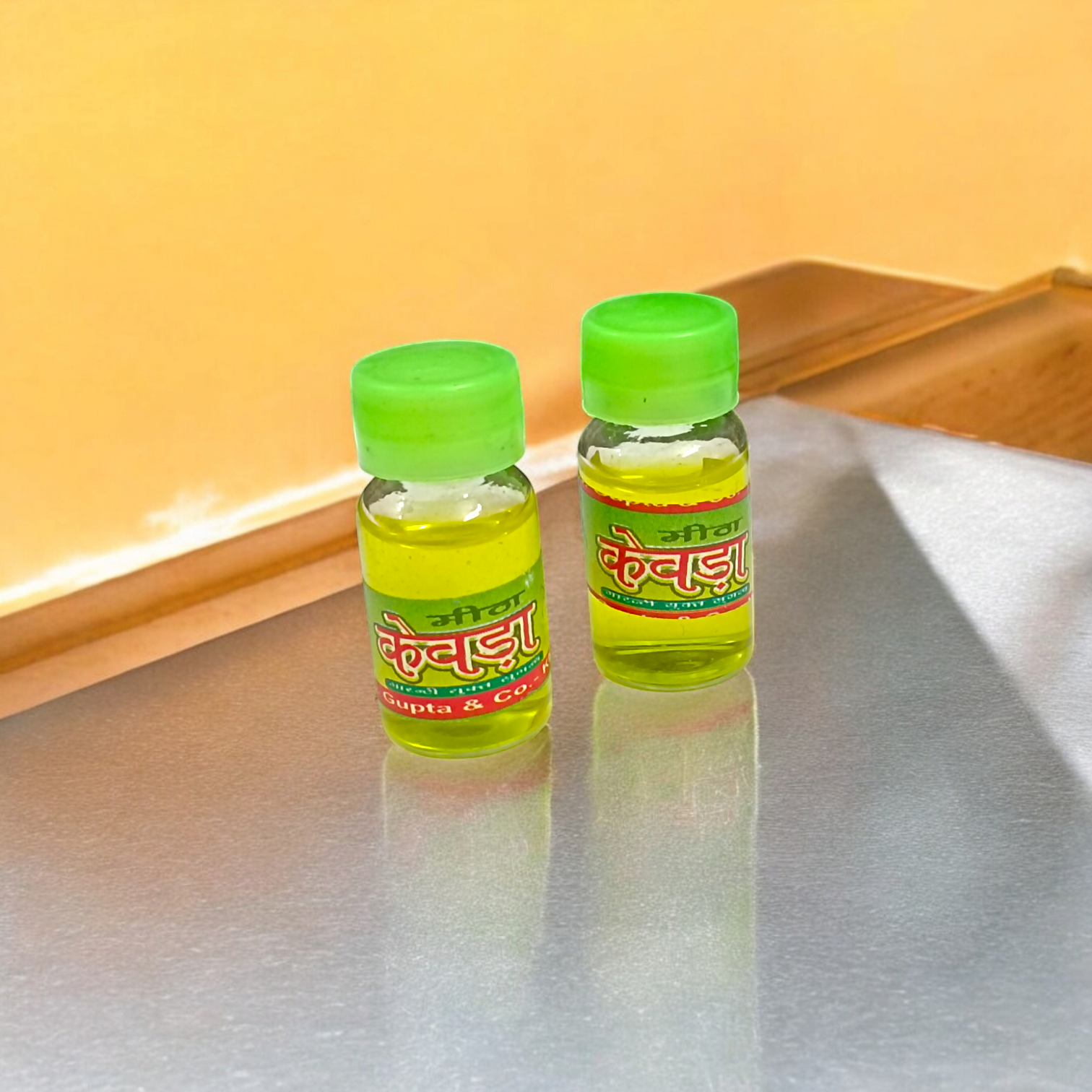 A bottle of Kewra Attar (4ML), alcohol-free, ideal for worship and spiritual practices, with a floral fragrance