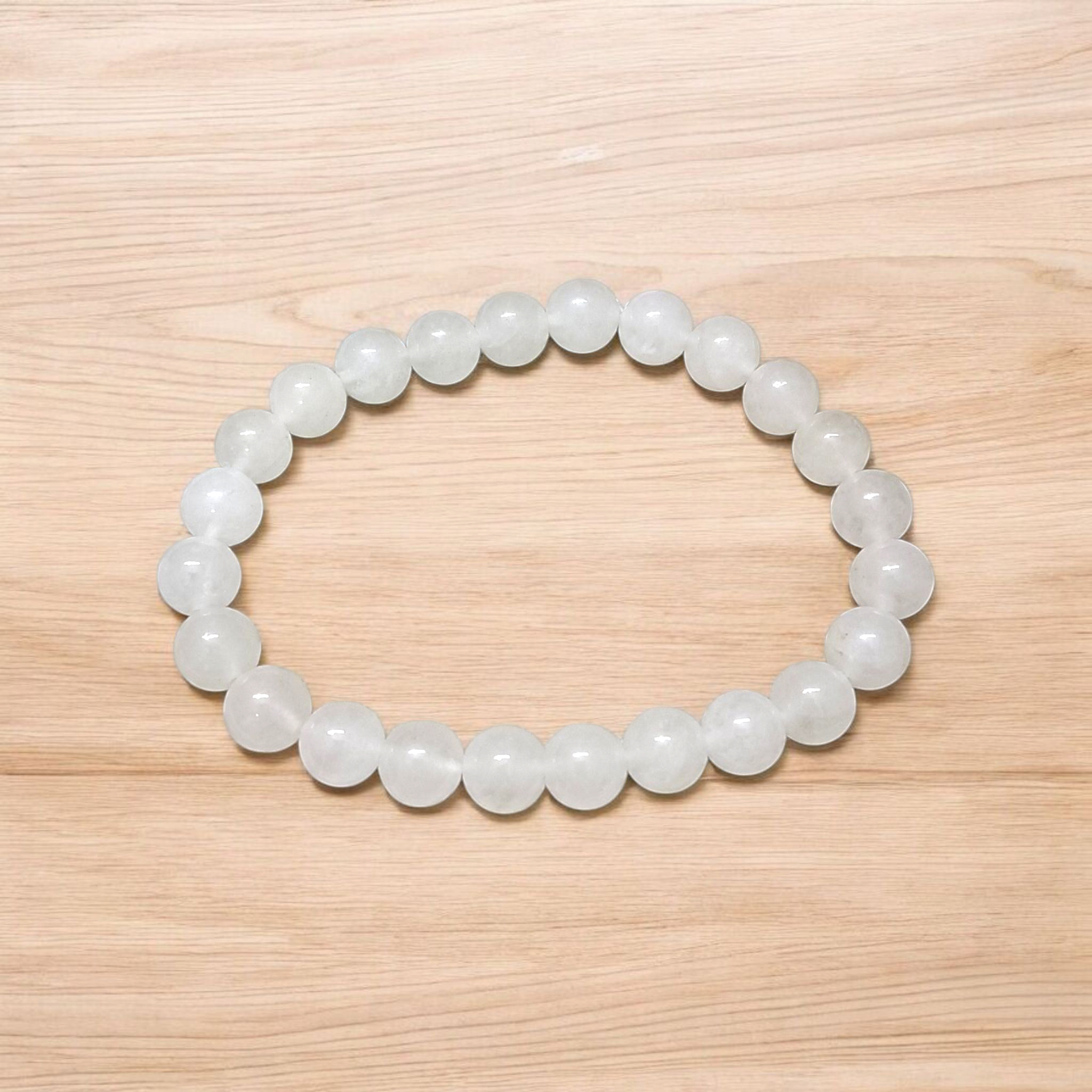 A close-up image of a White Agate (Safed Hakik) Bracelet, showcasing the lab-certified genuine white agate stones