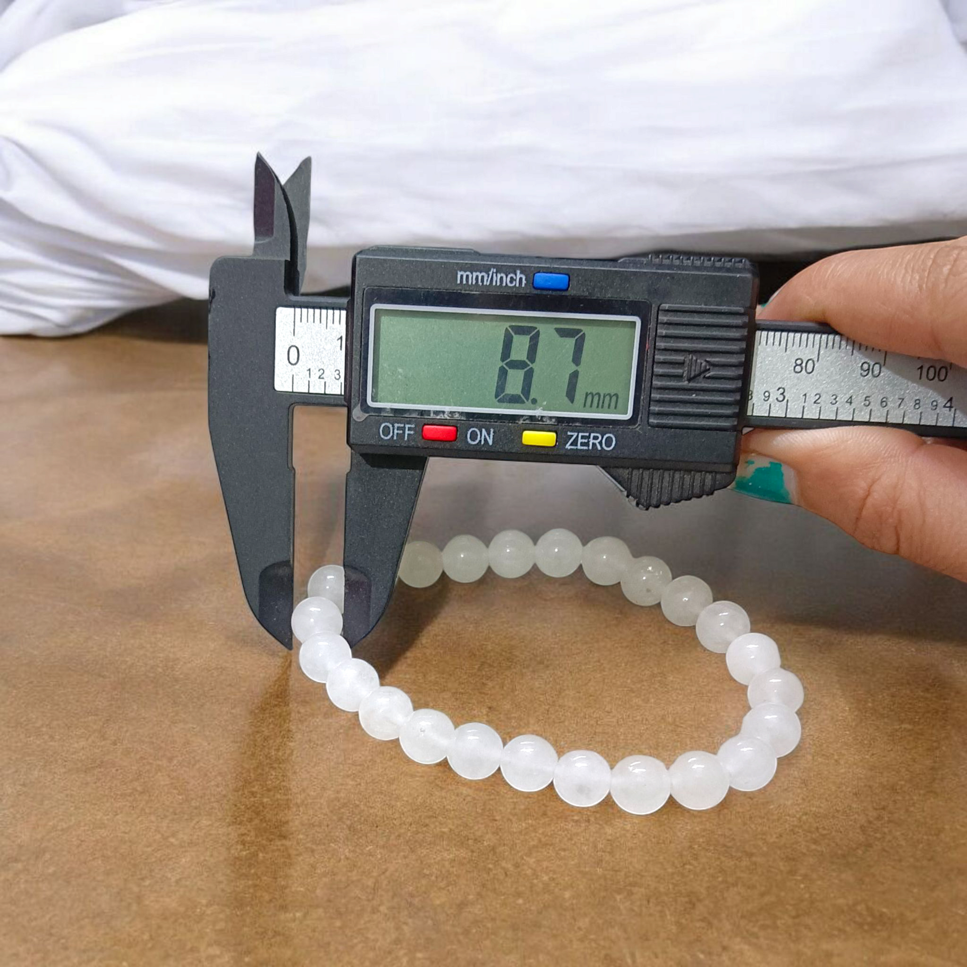 A close-up image of a White Agate (Safed Hakik) Bracelet, showcasing the lab-certified genuine white agate stones