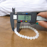 A close-up image of a White Agate (Safed Hakik) Bracelet, showcasing the lab-certified genuine white agate stones