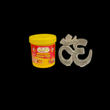 A close-up image of the Om Tilak Sancha, a brass stamp used for applying sacred Om tilak on the forehead during worship rituals and religious ceremonies.