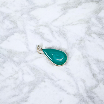 A close-up view of the Original Green Emerald Penna Pendant, showcasing the lab-certified green emerald gemstone, perfect for enhancing emotional wellbeing.