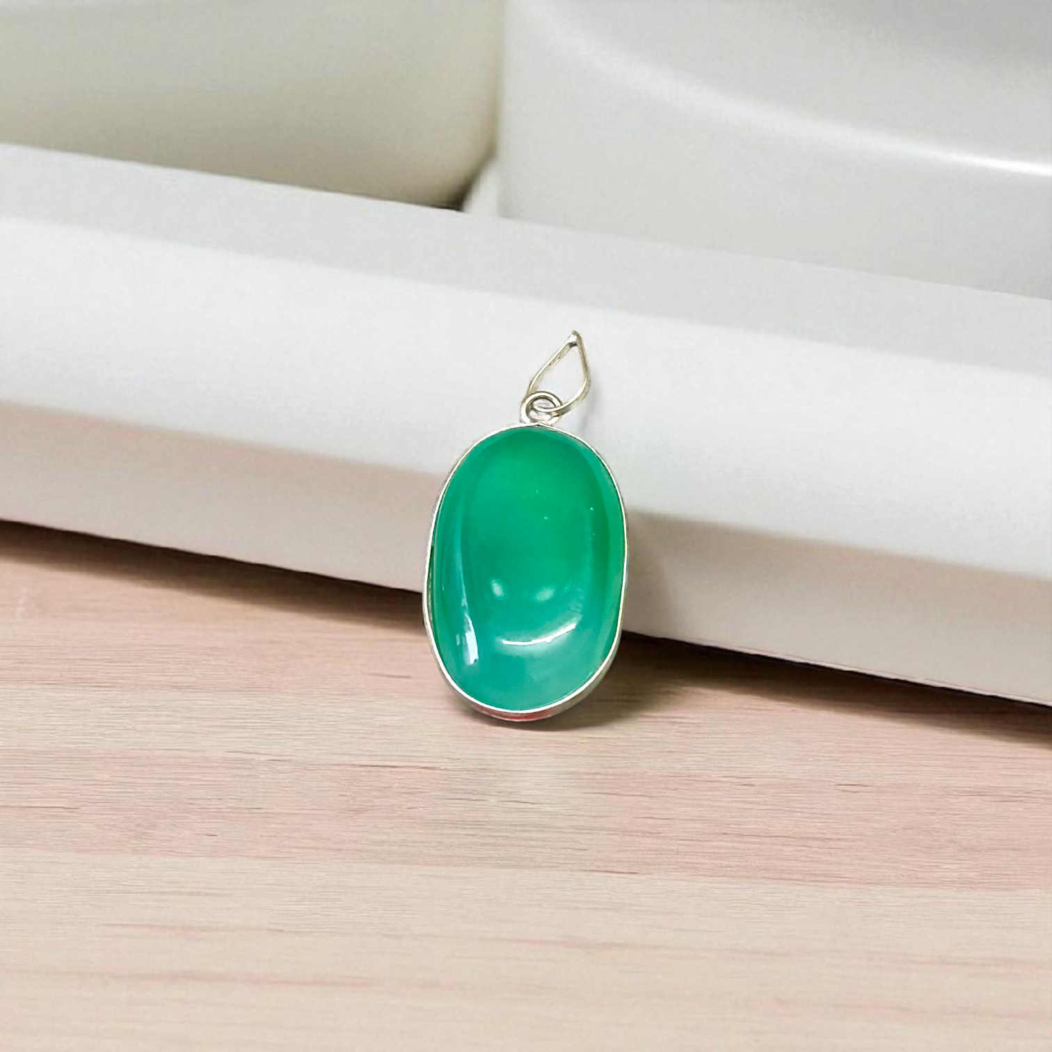 A close-up view of the Original Green Emerald Penna Pendant, showcasing the lab-certified green emerald gemstone, perfect for enhancing emotional wellbeing.