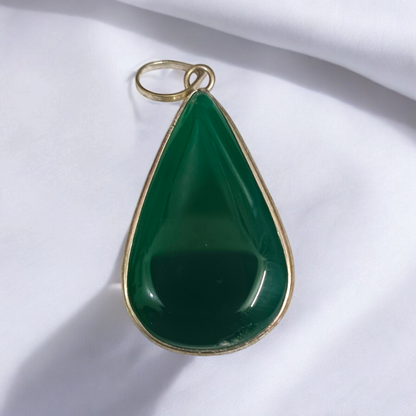 A close-up view of the Original Green Emerald Penna Pendant, showcasing the lab-certified green emerald gemstone, perfect for enhancing emotional wellbeing.