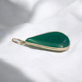 A close-up view of the Original Green Emerald Penna Pendant, showcasing the lab-certified green emerald gemstone, perfect for enhancing emotional wellbeing.