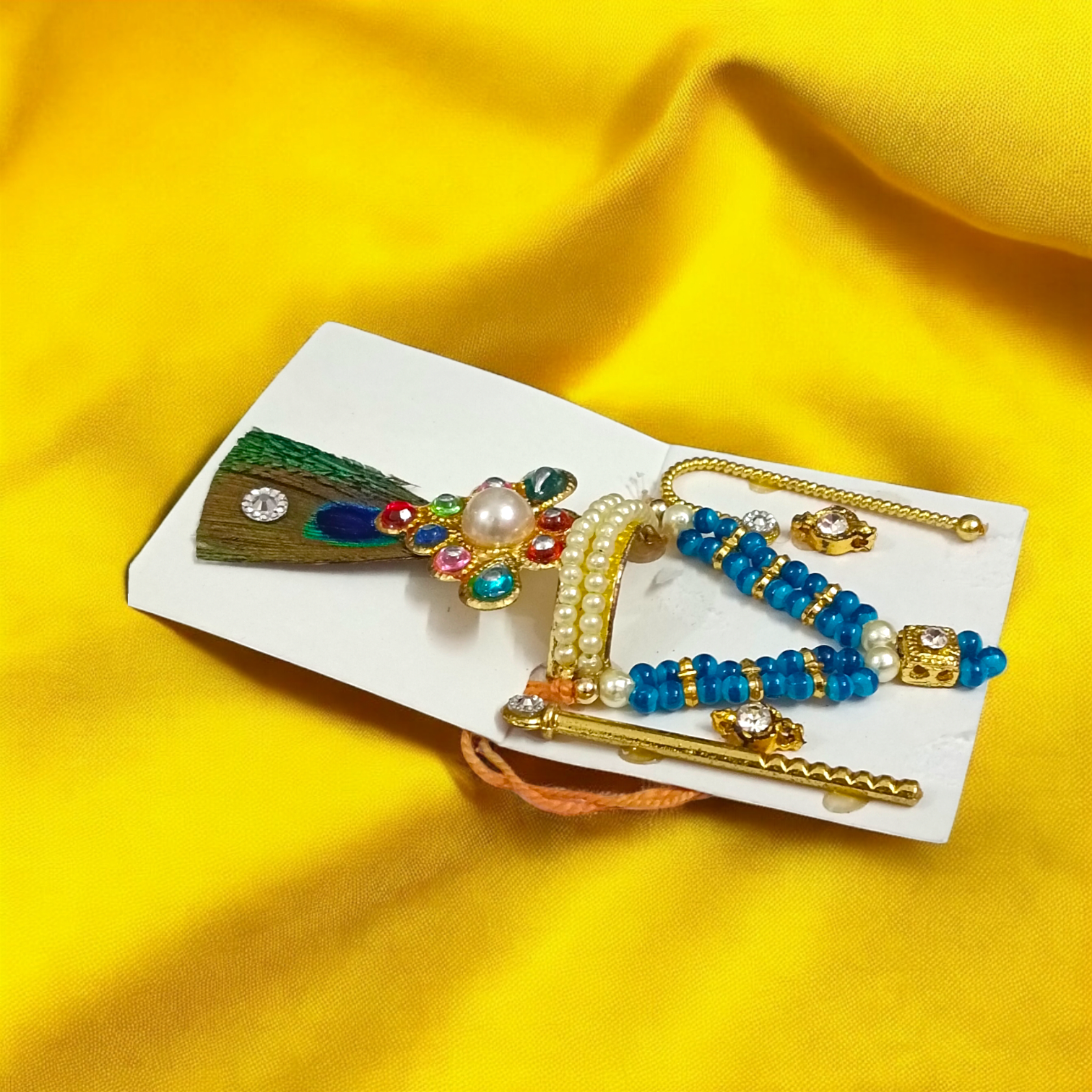 A complete Laddu Gopal Shringaar Set featuring Mukut, Bangle, Mala, Earrings, Bansuri, and Bindi to adorn Krishna idols.