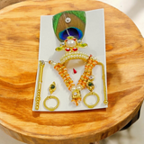 A complete Laddu Gopal Shringaar Set featuring Mukut, Bangle, Mala, Earrings, Bansuri, and Bindi to adorn Krishna idols.