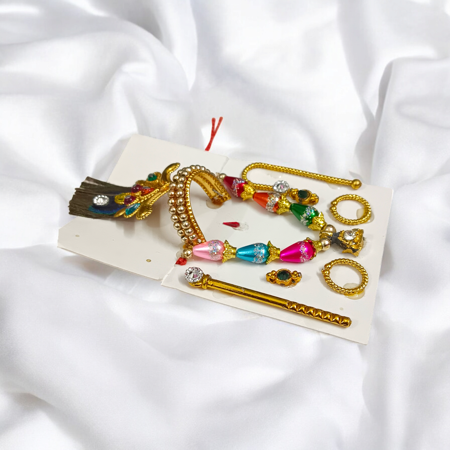 A complete Laddu Gopal Shringaar Set including Mukut, Earrings, Bangles, Mala, and Bansuri for adorning Krishna idols.