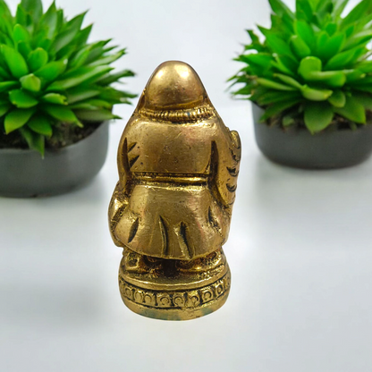 A detailed and polished brass statue of the Laughing Buddha in a standing pose, symbolizing good luck, prosperity, and happiness.