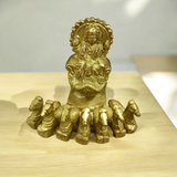 A detailed brass statue of Lord Surya riding a chariot, symbolizing vitality, health, and prosperity, crafted with intricate features and a polished finish.